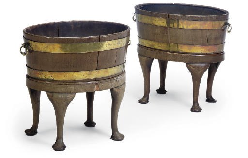 A PAIR OF GEORGE III BRASS BOUND MAHOGANY WINE COOLERS