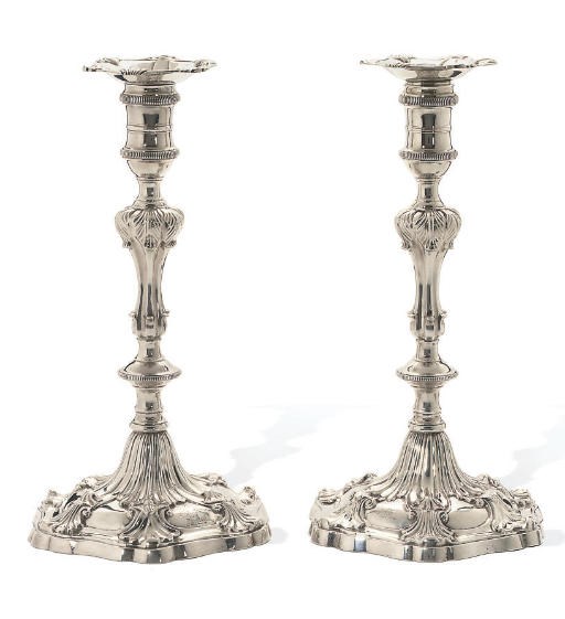 A MATCHING PAIR OF GEORGE III CAST SILVER CANDLESTICKS