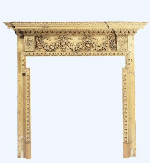 A GEORGE III CARVED PINE CHIMNEYPIECE