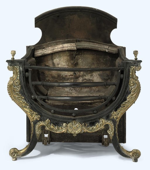 AN EARLY VICTORIAN CAST IRON AND BRASS FIRE GRATE