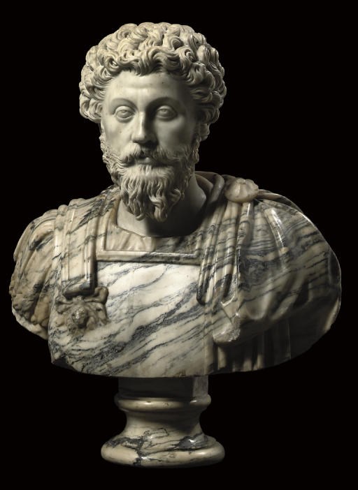 AN ITALIAN WHITE AND VARIEGATED MARBLE BUST OF MARCUS AURELIUS