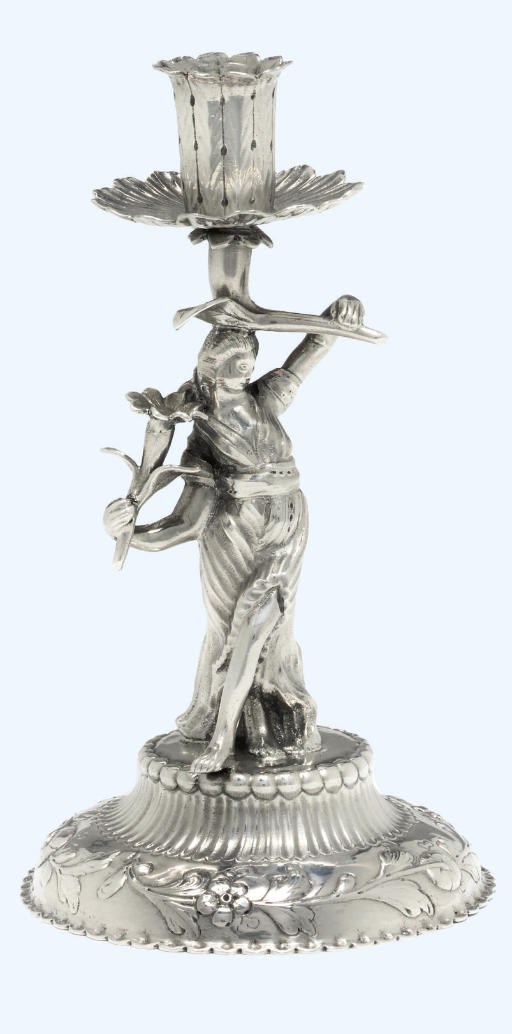 A GEORGE III SILVER FIGURAL TAPERSTICK