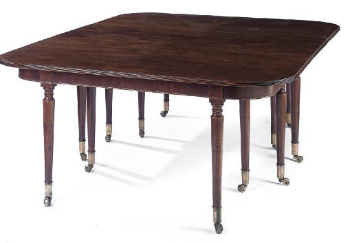 A REGENCY MAHOGANY THREE-SECTION DINING TABLE