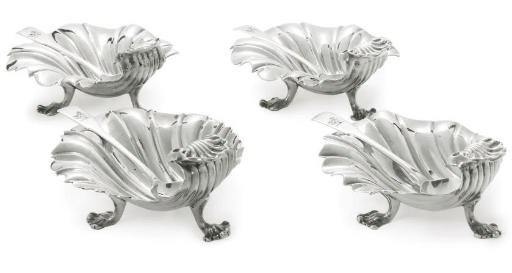 A MATCHED SET OF FOUR GEORGE IV PARCEL-GILT SILVER BUTTER SHELLS