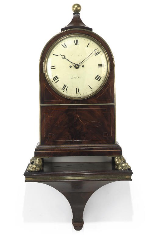 A large Regency mahogany striking eight day bracket clock and bracket