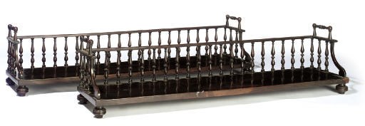 A PAIR OF MAHOGANY BOOK TROUGHS OF LARGE SIZE