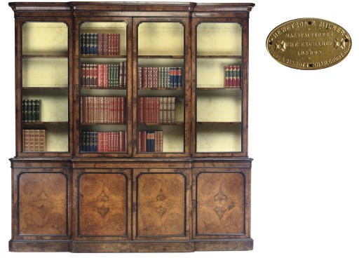 A MID-VICTORIAN BURR WALNUT AND EBONISED BREAKFRONT BOOKCASE
