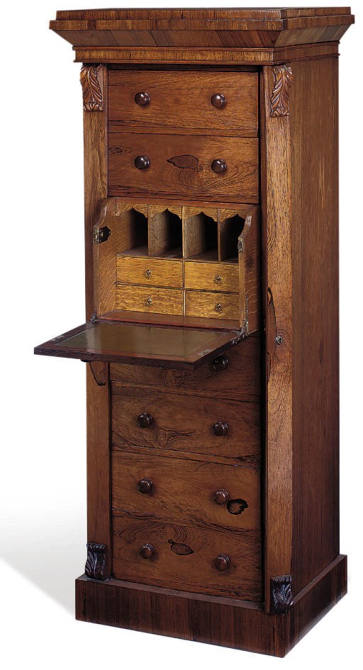AN EARLY VICTORIAN ROSEWOOD SECRETAIRE WELLINGTON CHEST