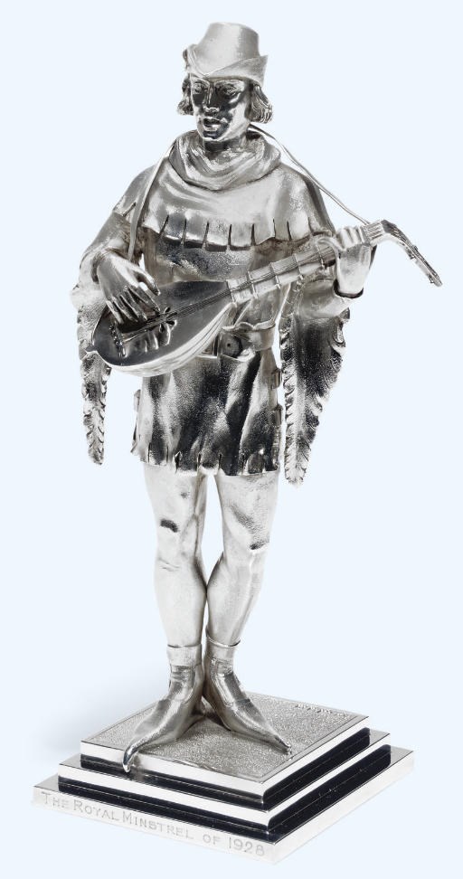 A SILVER PRESENTATION STATUETTE OF A MEDIEVAL MINSTREL