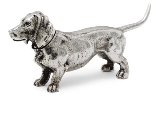AN EDWARDIAN NOVELTY SILVER PEPPER IN THE FORM OF A DACHSHUND