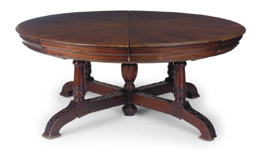A LATE VICTORIAN MAHOGANY CIRCULAR EXTENDING DINING TABLE