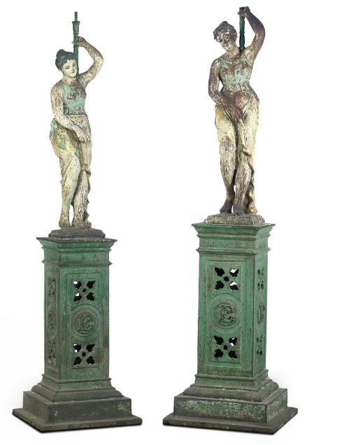 A LARGE PAIR OF INDIAN POLYCHROME DECORATED CAST-IRON FIGURAL TORCHERES
