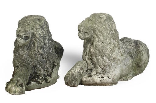A PAIR OF COMPOSITE STONE RECUMBENT LION