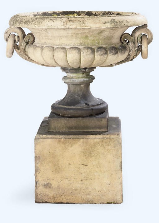 A TERRACOTTA URN AND PEDESTAL