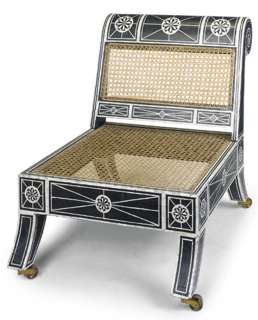 A MOORISH EBONISED AND MOTHER-OF-PEARL INLAID CHAIR