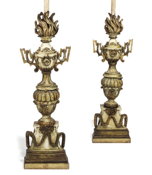 A PAIR OF ITALIAN DECORATED AND PARCEL-GILT CANDLESTICKS