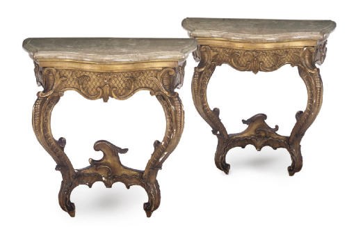 A PAIR OF FRENCH GILTWOOD SERPENTINE CONSOLE TABLES