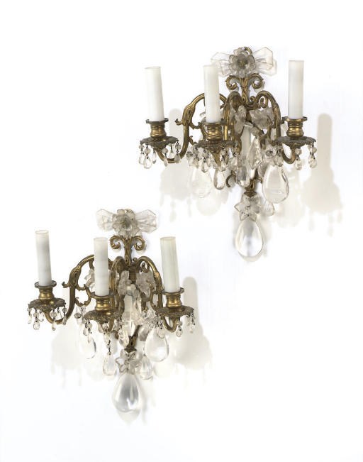 A PAIR OF FRENCH GILT-BRASS AND ROCK-CRYSTAL THREE-LIGHT WALL APPLIQUES