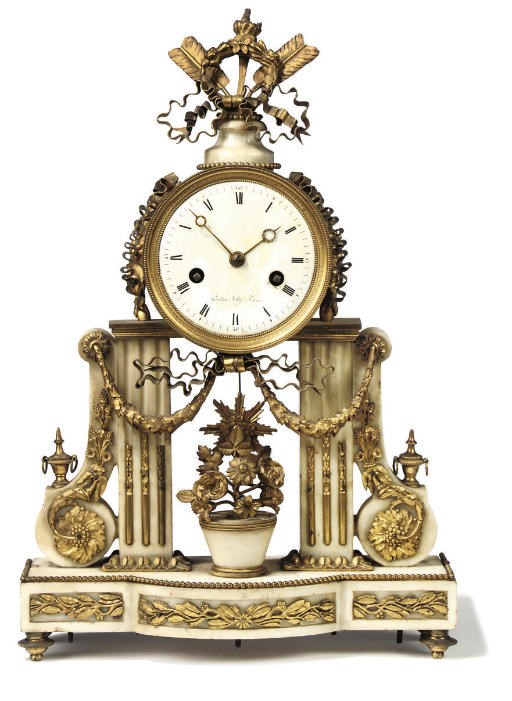 A FRENCH GILT-BRONZE MOUNTED WHITE MARBLE MANTEL CLOCK