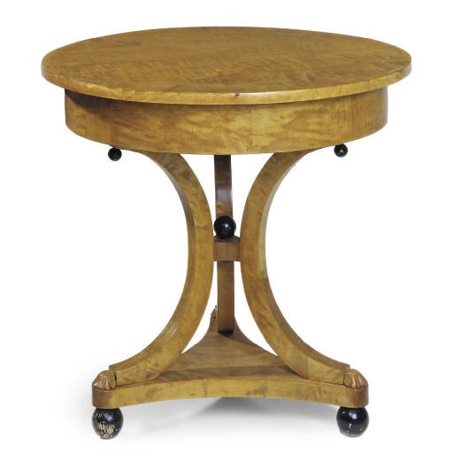 A BIRCH AND EBONISED CIRCULAR CENTRE TABLE