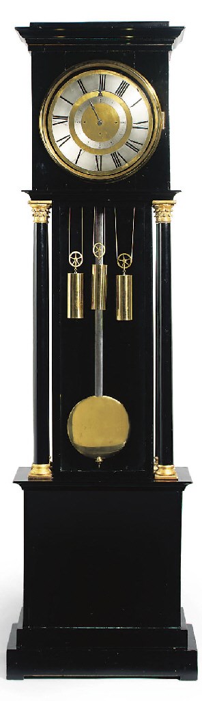 An unusual Austrian ebonised and giltwood grande sonnerie eight day longcase regulator with revolving chapter ring