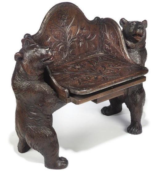 A SWISS 'BLACK FOREST' CARVED WOOD MUSICAL CHAIR
