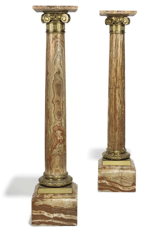 A PAIR OF FRENCH GILT-BRONZE MOUNTED ONYX PEDESTAL COLUMNS
