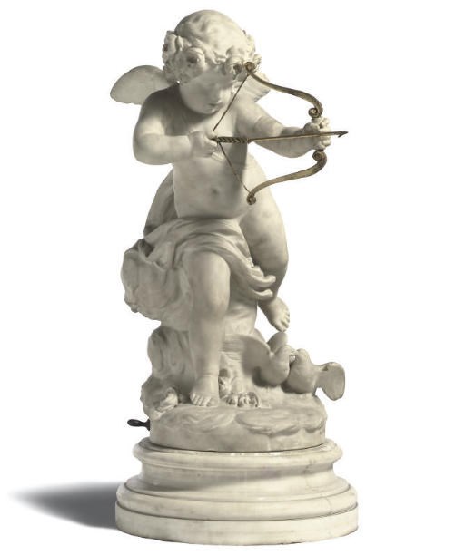 AN ITALIAN CARVED MARBLE MODEL OF CUPID