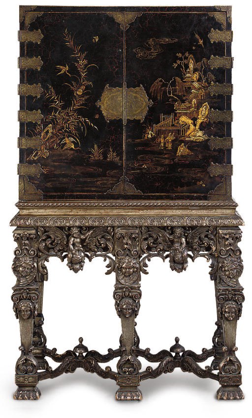 A LATE VICTORIAN JAPANNED AND BRASS MOUNTED CABINET ON STAND