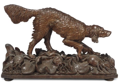 A SWISS 'BLACK FOREST' CARVED WOOD MODEL OF A SETTER