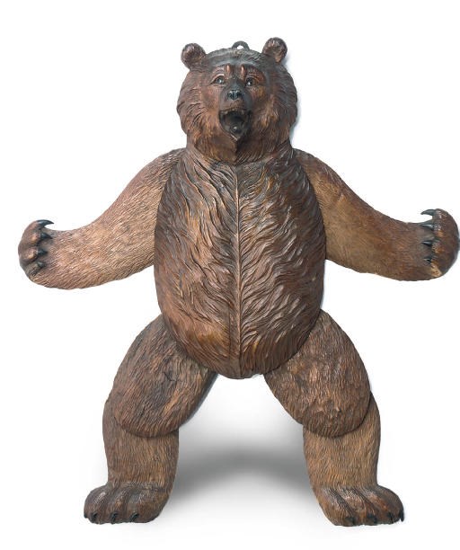 A SWISS 'BLACK FOREST' CARVED WOOD ARTICULATED WALL HANGING BEAR