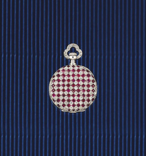 AN EARLY 20TH CENTURY WHITE GOLD, DIAMOND AND RUBY KEYLESS FOB WATCH