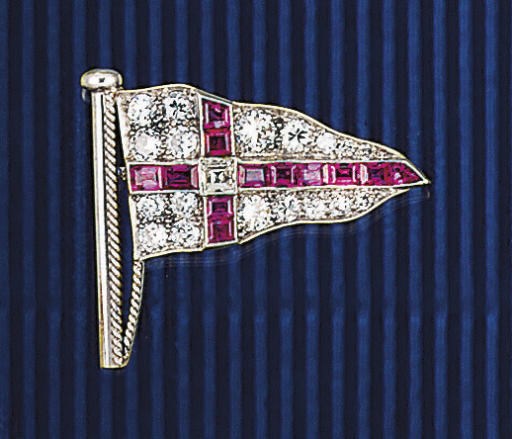 A diamond and ruby yachting burgee brooch
