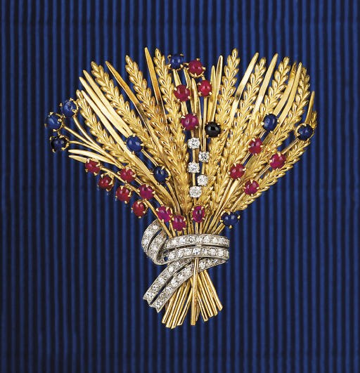 A RUBY, SAPPHIRE AND DIAMOND BROOCH