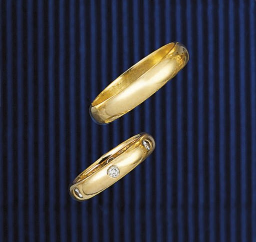 TWO 18CT. GOLD BAND RINGS, BY CARTIER