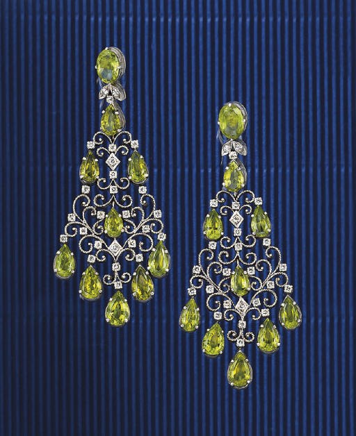 A pair of diamond and peridot earpendants