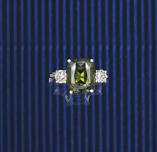 A GREEN ZIRCON AND DIAMOND THREE STONE RING