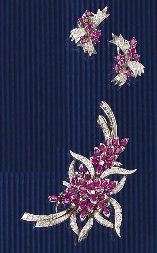 A ruby and diamond brooch and matching earrings