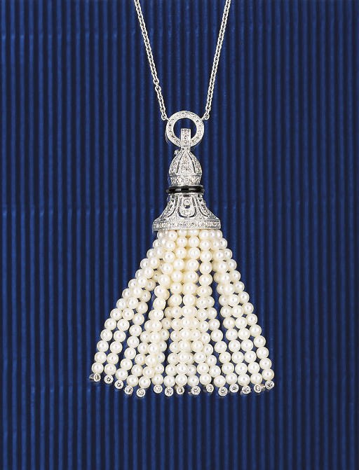 A diamond, onyx and cultured pearl pendant