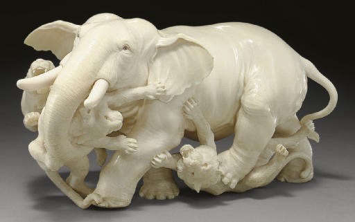 A Ivory Model of an Elephant and Tigers**