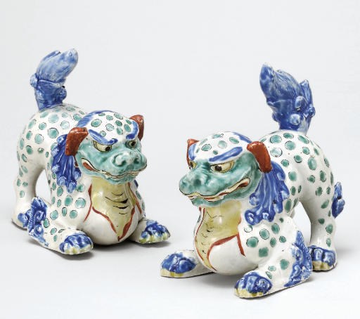 A Pair of Porcelain Models of Chinese Lions