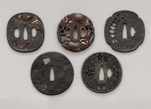 An Iwamoto School Tsuba, a Tenbo Tsuba, a Shoami Tsuba, a Bushu Tsuba and a Ko-Kinko Tsuba