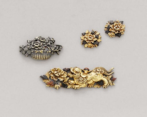 A Pair of Ishiguro School Menuki, an Ishiguro School Menuki and a Inagawa School Pouch Clasp