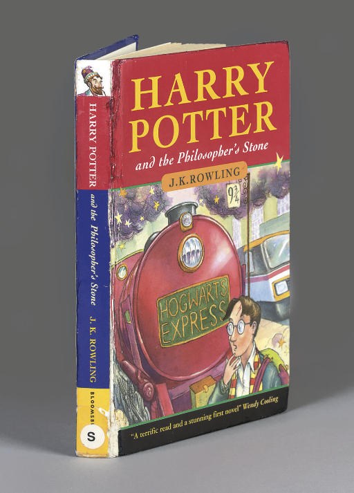 ROWLING, J. K.  Harry Potter and the Philosopher's Stone. [London:] Bloomsbury, 1997. 8°. Half title (some light yellow staining to first 2 leaves of text). Original coloured pictorial boards by Thomas Taylor (spine repaired with some creasing and rubbing to joints and corners). Ex-library copy with library label on verso of title and barcode sellotaped onto front free endpaper. Loosely-inserted is a publisher's slip SIGNED BY THE AUTHOR. FIRST EDITION. EXCEPTIONALLY SCARCE, ONE OF ABOUT 500 COPIES ONLY. According to the publishers, some 300 of these copies were distributed to school libraries.