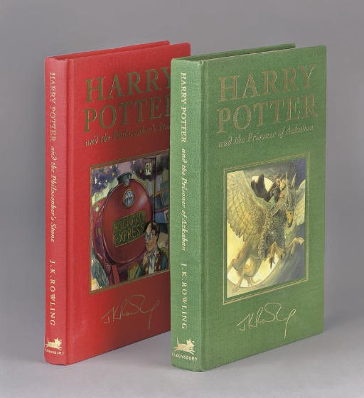 ROWLING, J. K.  HARRY POTTER AND THE PHILOSOPHER'S STONE. [LONDON:] BLOOMSBURY, 1999. LARGE 8° (234 X 150MM). HOGWARTS' COAT-OF-ARMS AND MOTTO ON HALF TITLE AND TITLE. ORIGINAL RED CLOTH LETTERED IN GILT WITH COLOURED PICTORIAL LABEL BY THOMAS TAYLOR INSET INTO UPPER COVER, GILT EDGES. FIRST DE-LUXE EDITION.