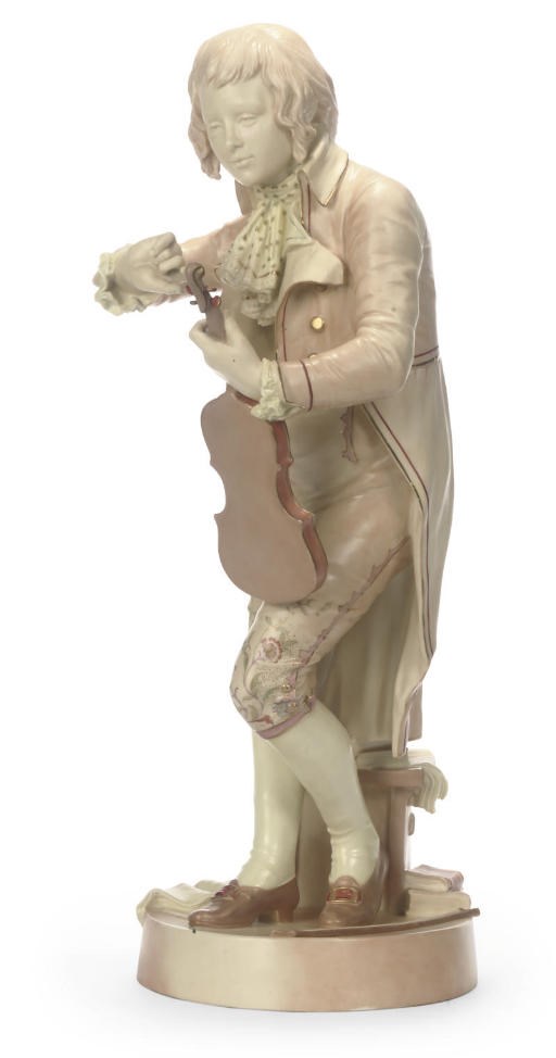 A ROYAL WORCESTER BLUSH-IVORY-GROUND FIGURE OF A MUSICIAN