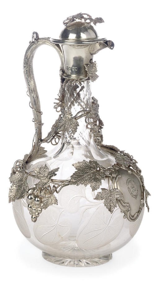 A VICTORIAN SILVER MOUNTED CLARET JUG
