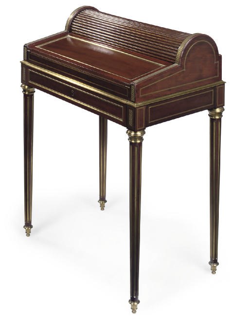 A FRENCH BRASS MOUNTED MAHOGANY WRITING TABLE