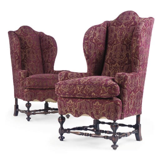 A PAIR OF STAINED BEECH HIGHBACK WING ARMCHAIRS