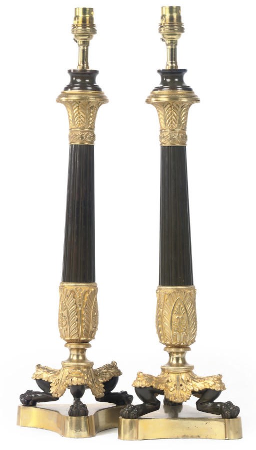 A PAIR OF PATINATED AND GILT BRONZE TABLE LAMPS